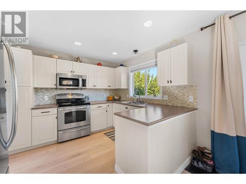 300 Murray Crescent, Kelowna, BC - Indoor Photo Showing Kitchen With Stainless Steel Kitchen