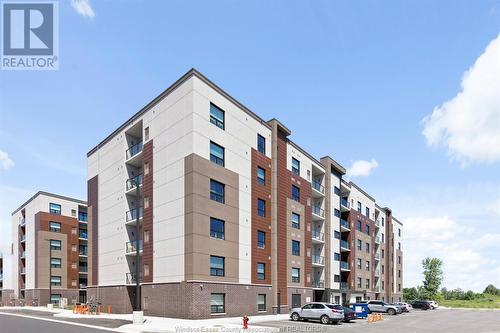 728 Brownstone Unit# 303, Lakeshore, ON - Outdoor With Balcony With Facade