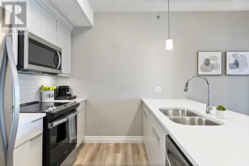 728 Brownstone Unit# 303, Lakeshore, ON - Indoor Photo Showing Kitchen With Double Sink