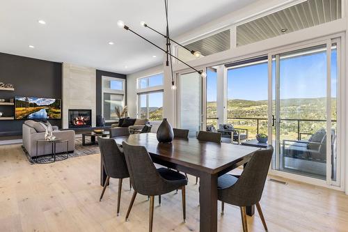 3004 Shaleview Drive, West Kelowna, BC - Indoor Photo Showing Dining Room With Fireplace