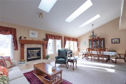 9292 Kokanee Road, Vernon, BC - Indoor Photo Showing Living Room With Fireplace