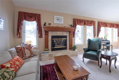 9292 Kokanee Road, Vernon, BC - Indoor Photo Showing Living Room With Fireplace