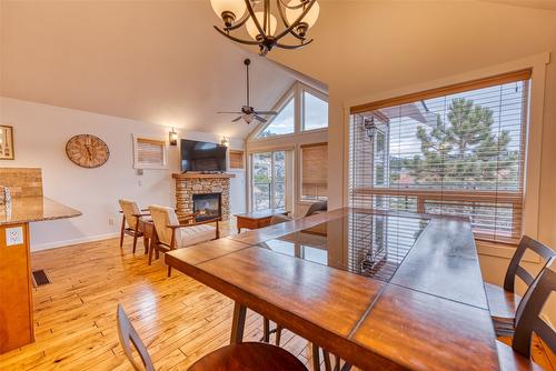 355-6819 Madrid Way, Kelowna, BC - Indoor Photo Showing Dining Room With Fireplace