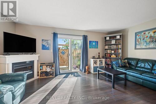 12 - 65 Dorchester Boulevard, St. Catharines, ON - Indoor Photo Showing Living Room With Fireplace