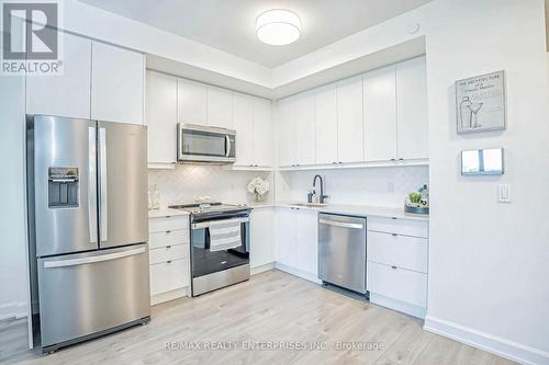 427 - 3200 William Coltson Avenue, Oakville, ON - Indoor Photo Showing Kitchen With Stainless Steel Kitchen With Upgraded Kitchen