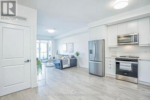 427 - 3200 William Coltson Avenue, Oakville, ON - Indoor Photo Showing Kitchen With Stainless Steel Kitchen