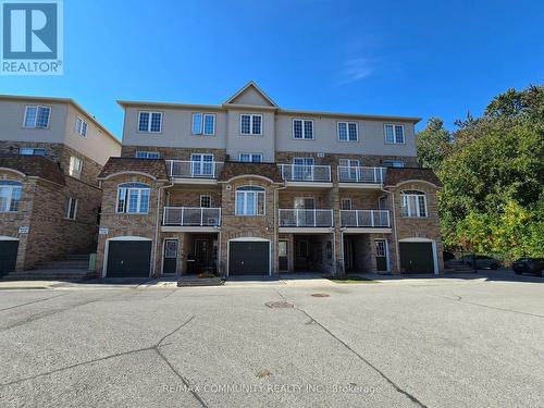 31 - 200 Mclevin Avenue, Toronto, ON - Outdoor With Facade