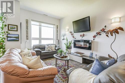 627 - 125 Shoreview Place, Hamilton, ON - Indoor Photo Showing Living Room With Fireplace