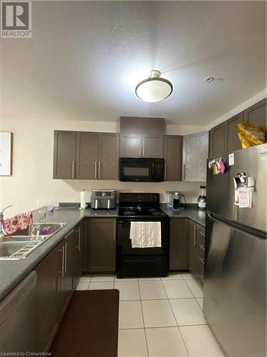 3200 Regional Road 56 Unit# 208, Binbrook, ON - Indoor Photo Showing Kitchen