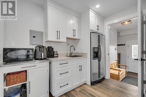 3154 Smith Creek Road, West Kelowna, BC - Indoor Photo Showing Kitchen With Fireplace