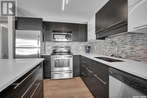 323 410 Ledingham Way, Saskatoon, SK - Indoor Photo Showing Kitchen With Double Sink With Upgraded Kitchen