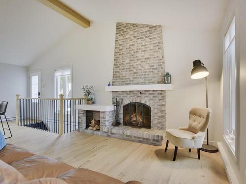 Living room - 135 Place Bonnard, Québec (Beauport), QC - Indoor Photo Showing Living Room With Fireplace