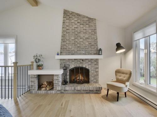 Living room - 135 Place Bonnard, Québec (Beauport), QC - Indoor Photo Showing Living Room With Fireplace