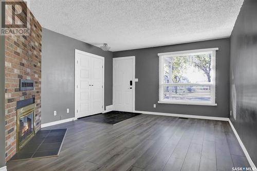 22 Cedar Meadow Drive, Regina, SK - Indoor Photo Showing Other Room With Fireplace