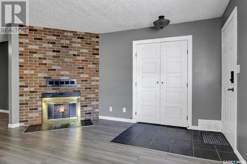 22 Cedar Meadow Drive, Regina, SK - Indoor Photo Showing Living Room With Fireplace