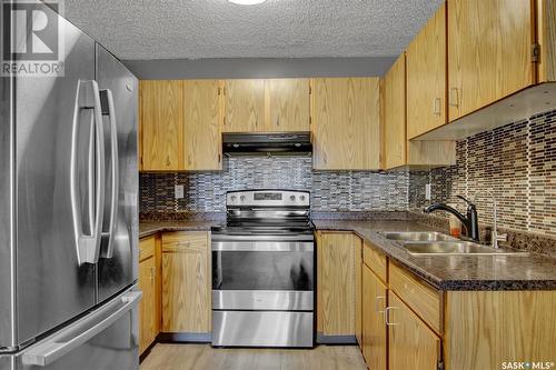 22 Cedar Meadow Drive, Regina, SK - Indoor Photo Showing Kitchen With Double Sink