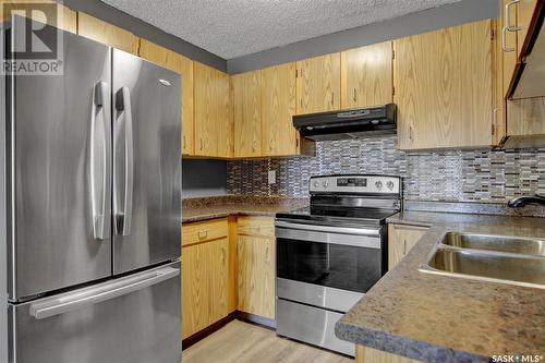 22 Cedar Meadow Drive, Regina, SK - Indoor Photo Showing Kitchen With Double Sink