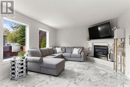 3332 Windsor Park Crescent, Regina, SK - Indoor Photo Showing Living Room With Fireplace