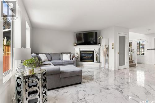 3332 Windsor Park Crescent, Regina, SK - Indoor Photo Showing Living Room With Fireplace