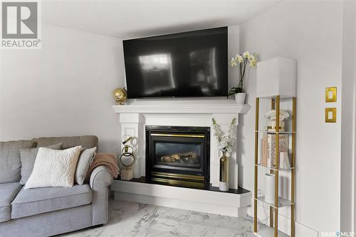 3332 Windsor Park Crescent, Regina, SK - Indoor Photo Showing Living Room With Fireplace