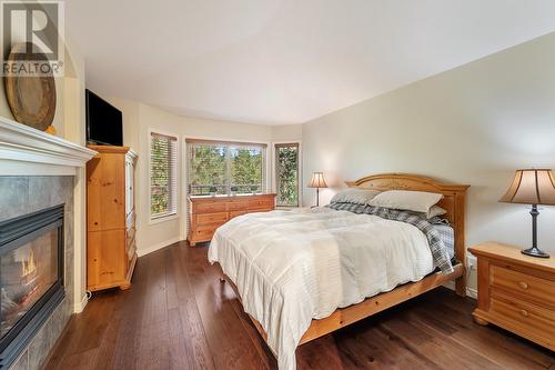 4117 Gallaghers Boulevard S, Kelowna, BC - Indoor Photo Showing Bedroom With Fireplace