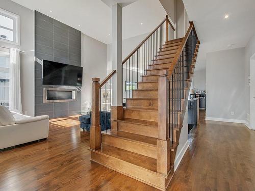 Escalier - 7 Rue De L'Andalou, Blainville, QC - Indoor Photo Showing Other Room With Fireplace