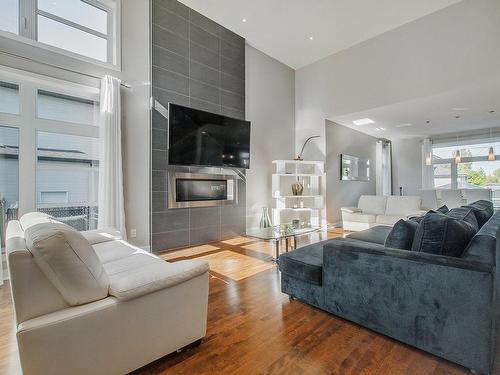 Salon - 7 Rue De L'Andalou, Blainville, QC - Indoor Photo Showing Living Room With Fireplace