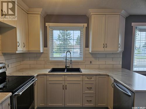 14 Macrae Bay, Carlyle, SK - Indoor Photo Showing Kitchen With Double Sink