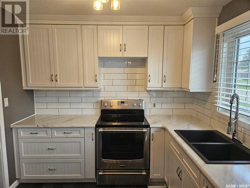 14 Macrae Bay, Carlyle, SK - Indoor Photo Showing Kitchen With Double Sink