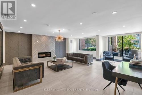 409 - 1270 Maple Crossing Boulevard, Burlington, ON - Indoor Photo Showing Other Room With Fireplace