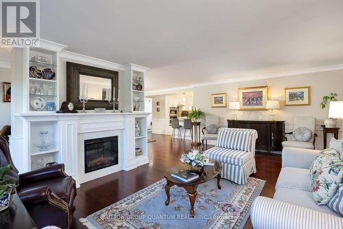 201 - 1400 Dixie Road, Mississauga, ON - Indoor Photo Showing Living Room With Fireplace