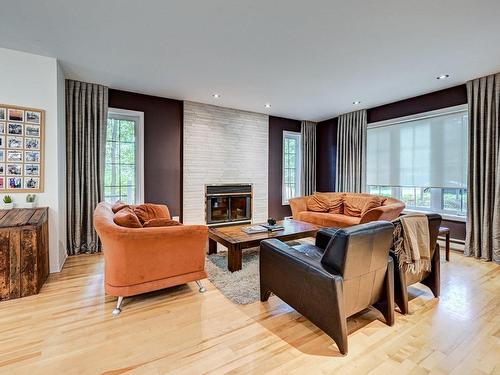 Living room - 16425 Rue De L'Esplanade, Mirabel, QC - Indoor Photo Showing Living Room With Fireplace