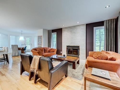 Living room - 16425 Rue De L'Esplanade, Mirabel, QC - Indoor Photo Showing Living Room With Fireplace