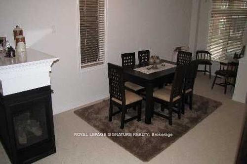 310 Scott Blvd, Milton, ON - Indoor Photo Showing Dining Room With Fireplace