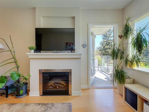 202-4394 West Saanich Rd, Saanich, BC - Indoor Photo Showing Living Room With Fireplace