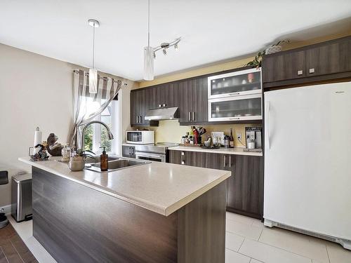 Cuisine - 13950  - 13952 Rue Gilles, Mirabel, QC - Indoor Photo Showing Kitchen With Double Sink With Upgraded Kitchen