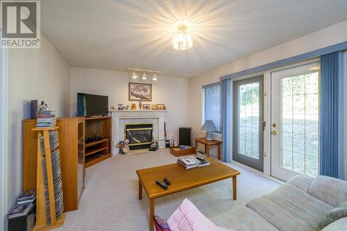 9052 North Nechako Road, Prince George, BC - Indoor Photo Showing Living Room With Fireplace