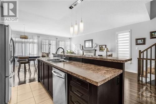 Open concept kitchen overlooking liv/din room - 715 Hazelnut Crescent, Ottawa, ON - Indoor Photo Showing Kitchen With Double Sink