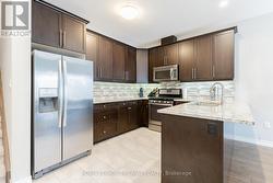 MAIN LEVEL: Quartz Kitchen w/ Stainless Appliances - 