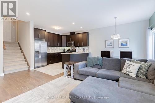 MAIN LEVEL: Stairs to master level - 48 - 2235 Blackwater Road, London, ON - Indoor Photo Showing Living Room