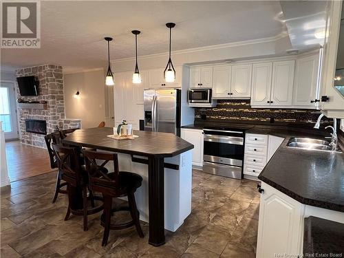 5 Richard Road, Drummond, NB - Indoor Photo Showing Kitchen With Fireplace With Double Sink