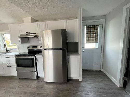 E 6 1545 Main Street E, Swan River, MB - Indoor Photo Showing Kitchen