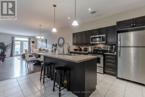 24 Manorwood Drive, West Lincoln, ON - Indoor Photo Showing Kitchen With Stainless Steel Kitchen With Double Sink With Upgraded Kitchen