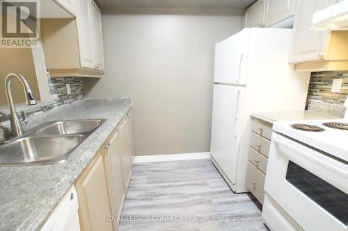 327 - 68 Corporate Drive, Toronto, ON - Indoor Photo Showing Kitchen With Double Sink