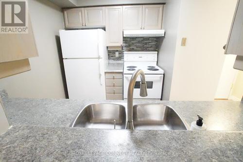 327 - 68 Corporate Drive, Toronto, ON - Indoor Photo Showing Kitchen With Double Sink