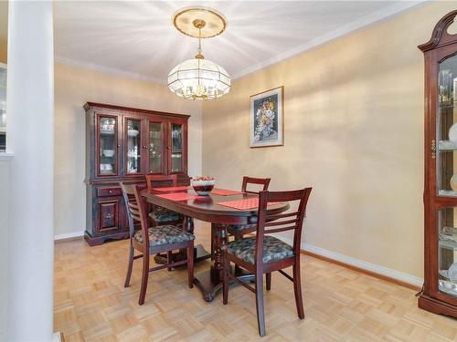 104-2050 White Birch Rd, Sidney, BC - Indoor Photo Showing Dining Room With Fireplace