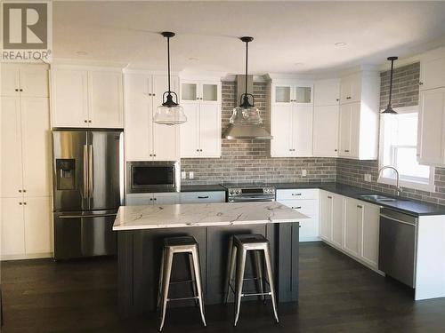 Photo is to illustrate similar kitchen layout, cabinet maker will work with Buyer to customize to buyer's taste - 6683 Yacht Boulevard, Cornwall, ON - Indoor Photo Showing Kitchen With Double Sink With Upgraded Kitchen