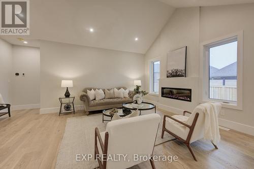 19 Carriage Crossing, Mapleton, ON - Indoor Photo Showing Living Room With Fireplace