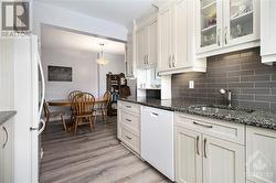 Step into a kitchen designed to impress with its sophisticated blend of style and functionality. Featuring stunning granite countertops, this kitchen offers ample space for meal preparation and ca - 