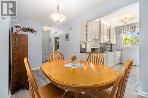 The seamless flow between the kitchen and dining area ensures that all is at hand, whether you're hosting a dinner party or enjoying a quiet meal with family. - 4629 Carrington Place, Ottawa, ON - Indoor Photo Showing Dining Room